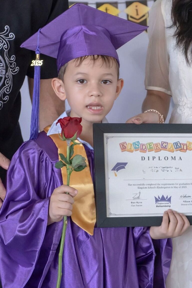 Photo of Den graduating from kindergarten