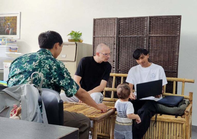 Photo of Pat and his team working on the Campus website