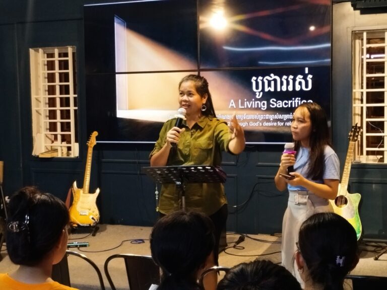 Photo of Pheap speaking at YWAM Siem Reaps community night.